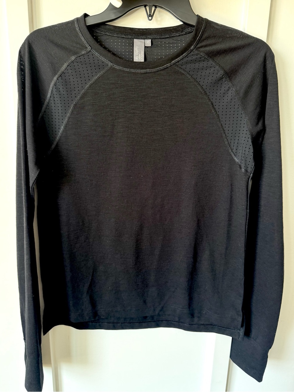 Sweaty Betty long-sleeve athletic top in classic black, women’s size XS.